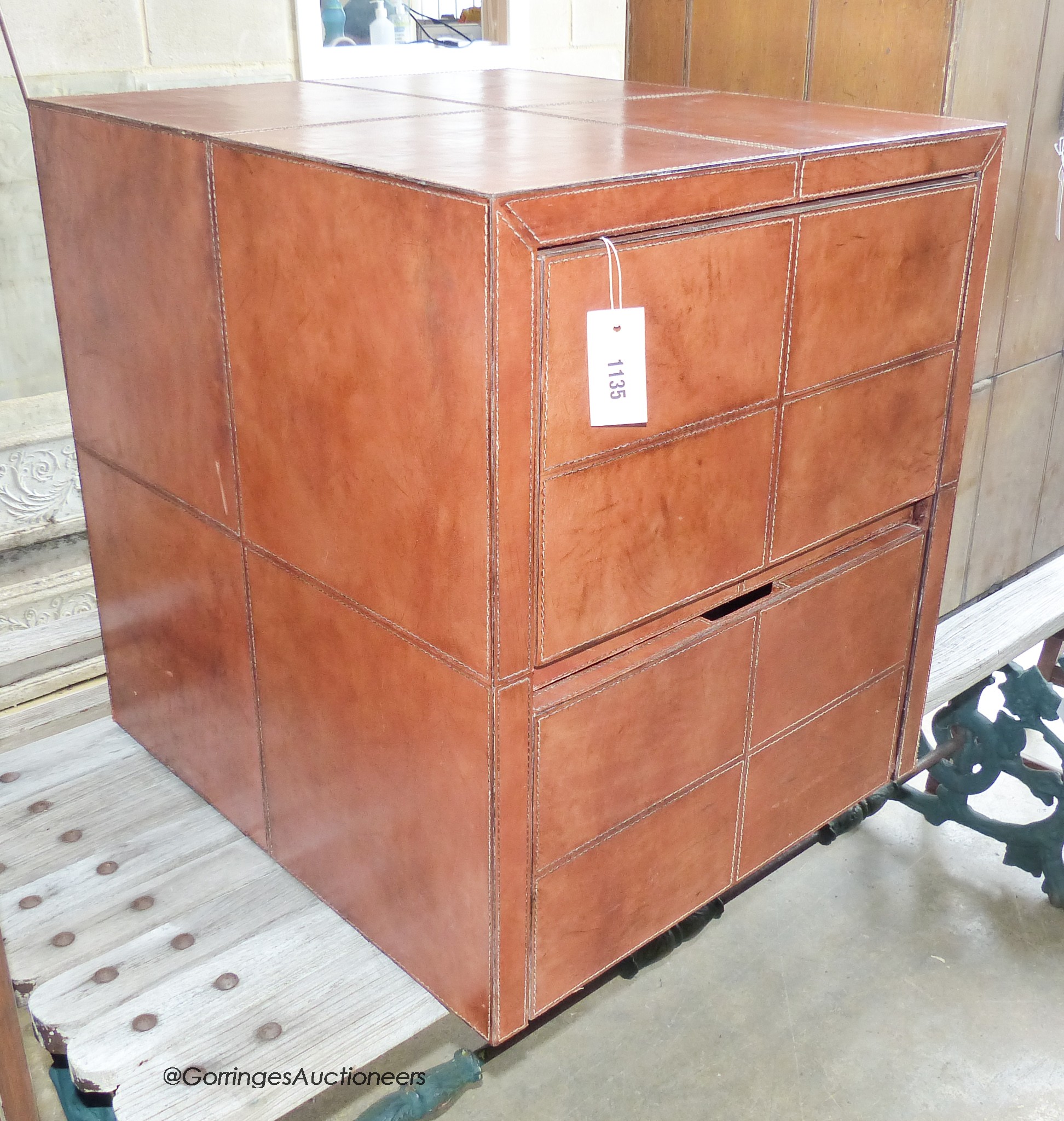 A stitched Tan leather two draw filing cabinet. W-54, D-60, H-62cm.